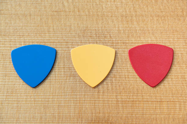 istock guitar pick on guitar top wood 1281107307