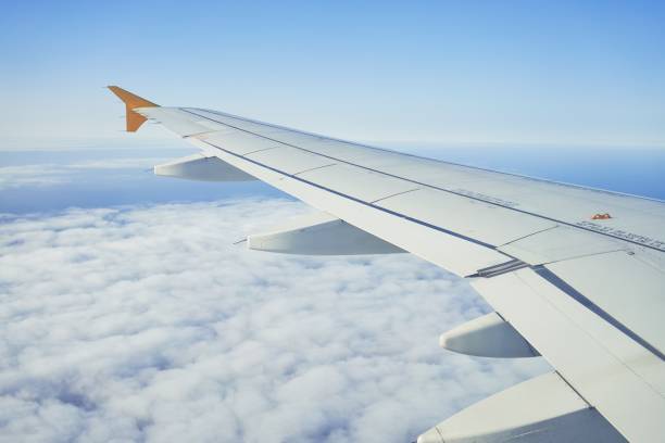 istock Cloudscape from window airplane, landscape of wing plane on a cloudy sky 1281107385