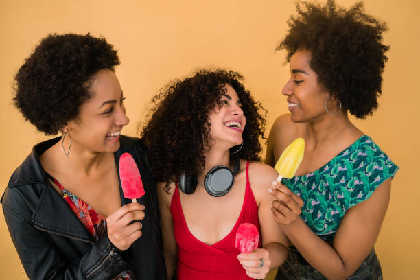 istock Multi-ethnic group of friends enjoying summertime while eating ice cream. 1281108638