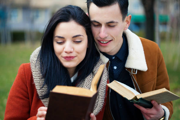 istock Young couple reading books 1281112327
