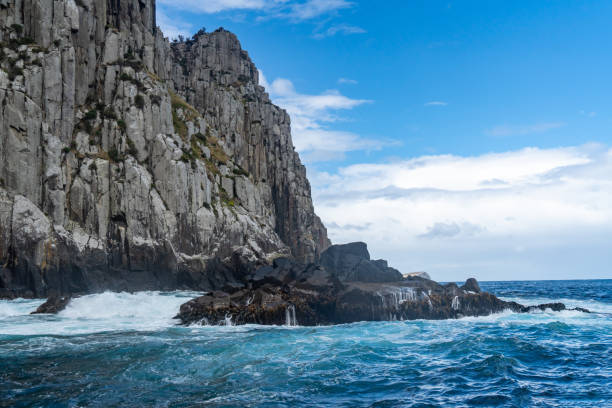 Photo of Thumbs Point and Cape Hauy, Eaglehawk Neck coastal cliff view on Tasman National Park conservation area, Port Arthur, Tasmania, Australia