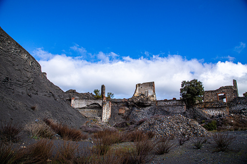 Entrance to inner mine buried by mountain of coal in Villanueva del Duque, AL, Spain