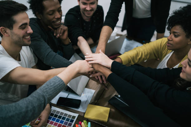 istock Team of work showing unity with their hand together. 1281114625