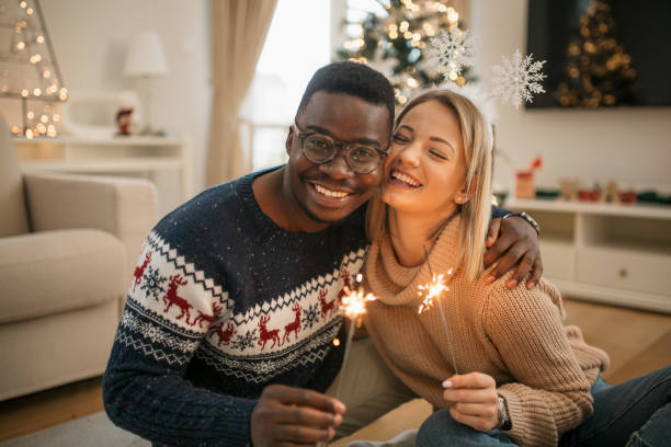 istock Happy diverse couple celebrating winter holidays together 1281119351