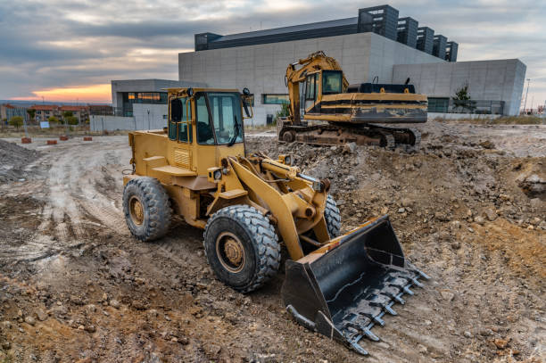 Two excavators at a construction site performing earthmoving Heavy machinery for the construction construction equipment stock pictures, royalty-free photos & images
