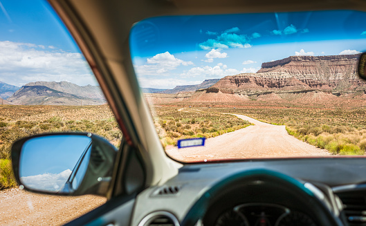 A driver's perspective on a dust road in rural Utah, USA.