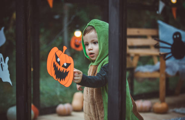 istock Baby boy in dinosaur costume 1281121530