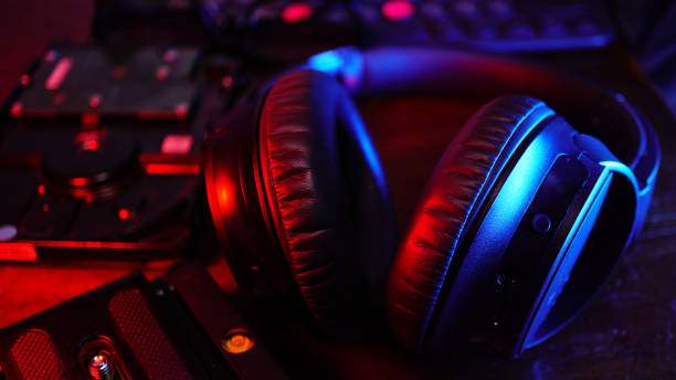 istock Close up headphone on mixer dj table in the party 1281122410