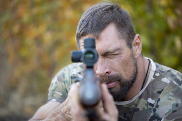 istock Close up image of male shooting rifle. 1281123437