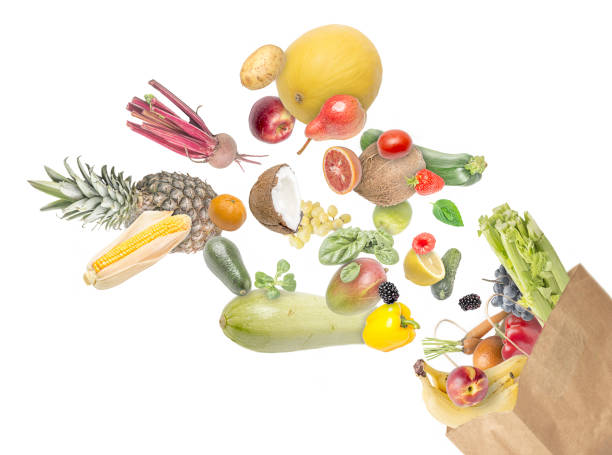 istock Paper bag full of different food on white background. 1281124364