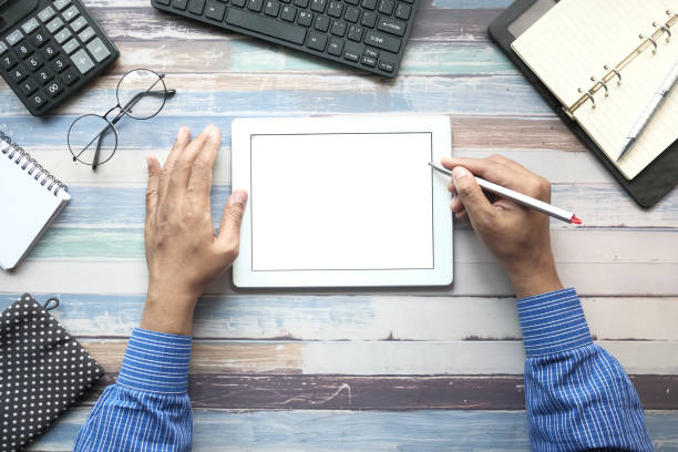 istock top view of man's hand working on digital tablet on office desk 1281125643