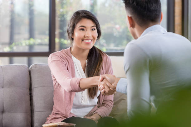 istock Female patient greets male therapist 1281125915