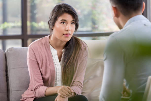 istock Woman listens to counselor 1281125920