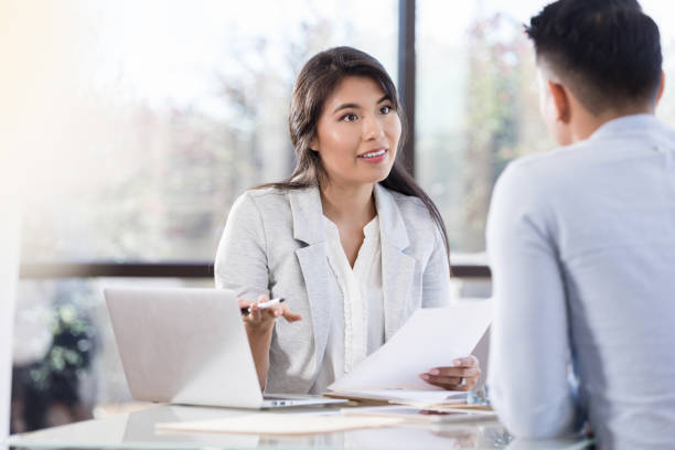 istock Businesswoman meets with client 1281125927