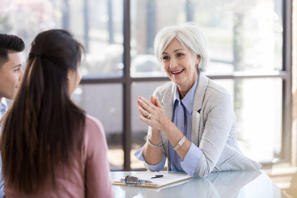 istock Smiling therapist talks with couple 1281125941