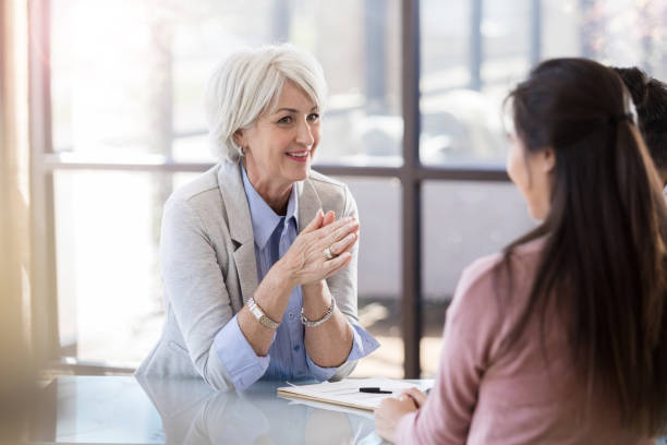 istock Happy doctor talks with patient 1281125947