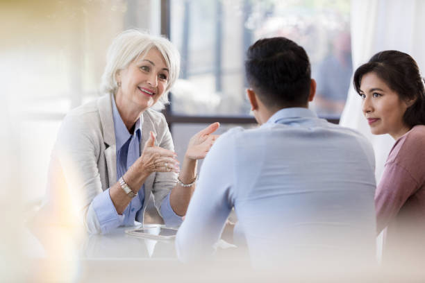 istock Marriage counselor encourages couple 1281125954