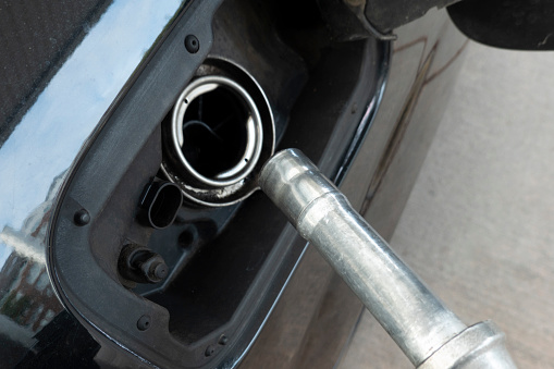 gasoline nozzle - filling the gasoline into the tank of the car