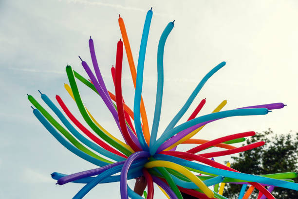 istock Colorful balloons on the sunny day sky Selective focus 1281128812