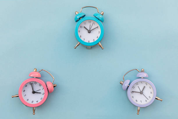 istock Simply minimal design three ringing twin bell classic alarm clock Isolated on blue pastel background. Rest hours time of life good morning night wake up awake concept. Flat lay top view copy space 1281129026