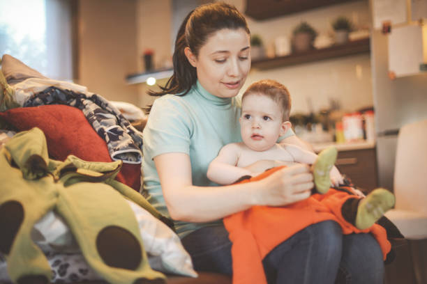 istock toddler boy playing with mom at home (1) 1281130313