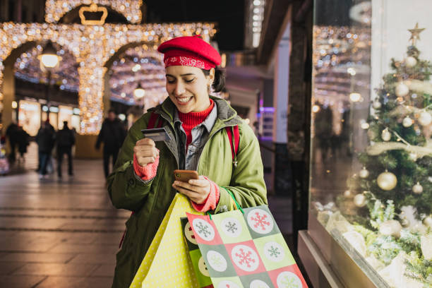 istock Young woman shopping for Christmas 1281130432