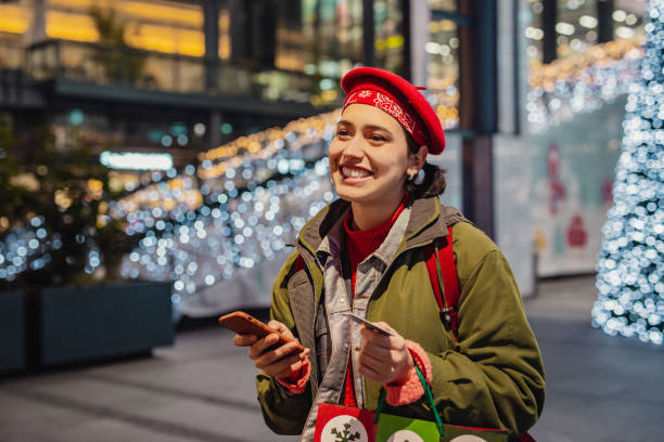 istock Young woman shopping for Christmas 1281131321