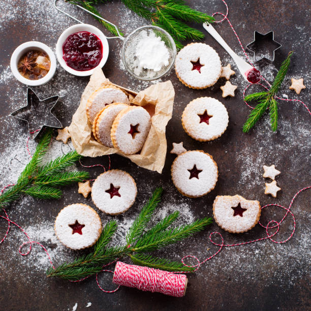 istock Traditional Christmas Linzer cookies with raspberry jam on dark background. 1281131940