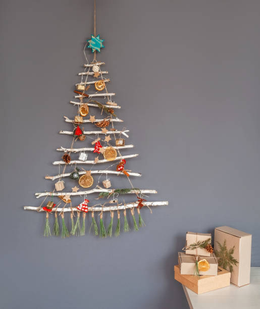 istock Alternative Christmas tree made with branches, decorated with ecological toys, zero waste holidays 1281133115