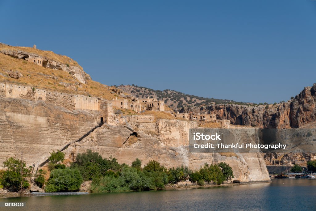 Abandoned stone houses on cliffs near the Euphrates River, Halfeti, Sanliurfa Province of Turkey Rumkale Stock Photo