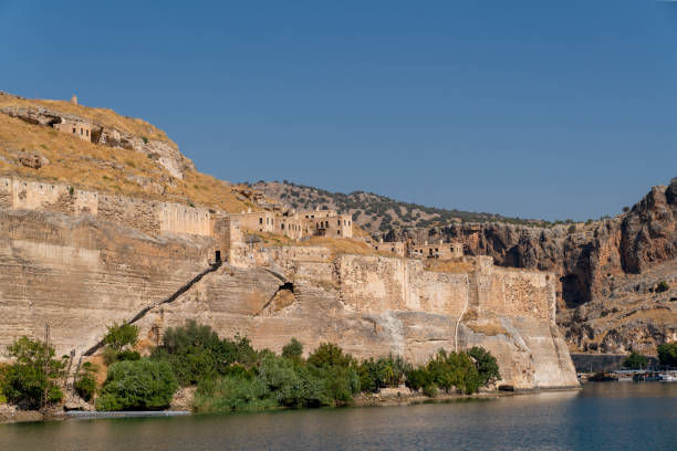 Abandoned stone houses on cliffs near the Euphrates River, Halfeti, Sanliurfa Province of Turkey Abandoned stone houses on cliffs near the Euphrates River, Halfeti, Sanliurfa Province of Turkey rumkale stock pictures, royalty-free photos & images