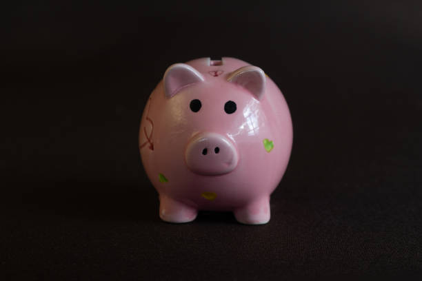 istock Piggy money box in dark background 1281136977