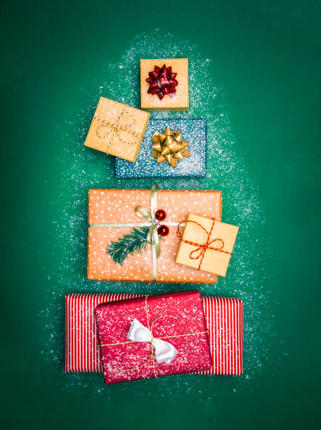 istock Christmas presents on a green table in form of Christmas tree 1281138229