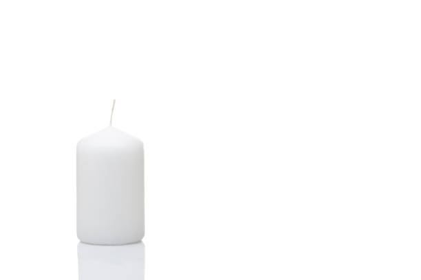 istock White unlit candle on a white background, isolated, Christmas decoration 1281139524