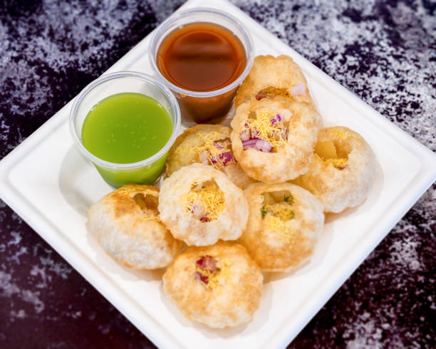 istock Delicious and Fresh Panipuri with dip sauce 1281141991