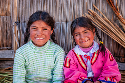 Happy children on Uros floating island, Lake Tititcaca, Peru