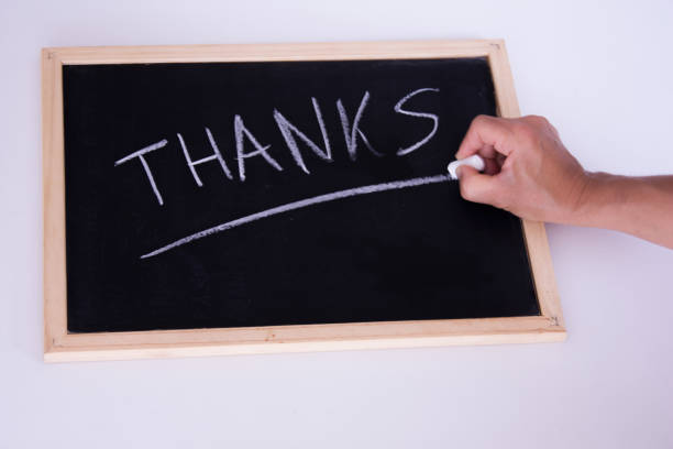 istock Hand writting the word thanks with chalk 1281146317