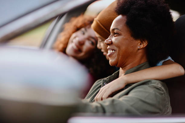 istock Mother driving in car with her kids 1281147532