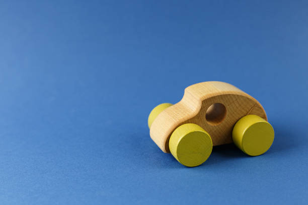 istock Wooden car on a blue background. 1281147860