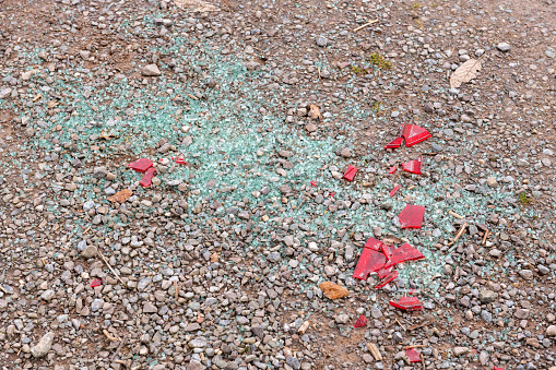 Smashed glass from a car window scattered on the ground
