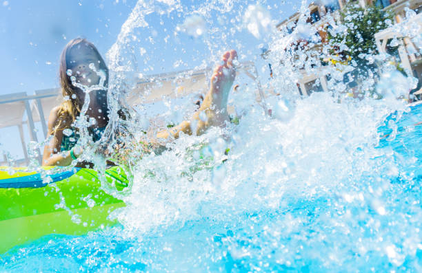 istock LIttle girl floating on water in pool 1281148991