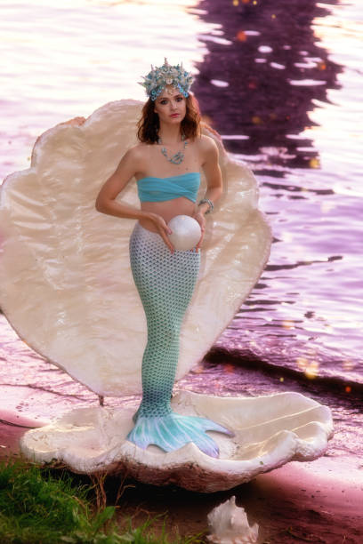 istock A beautiful mermaid girl stands in a large white shell 1281150474