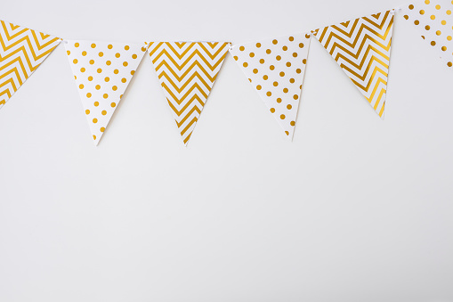 White and gold bunting flags isolated on white background