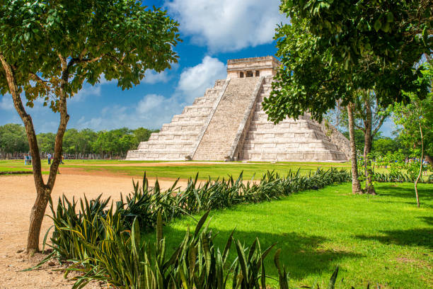 Main Pyramid Kukulkan in Chichen Itza with Trees stock photo