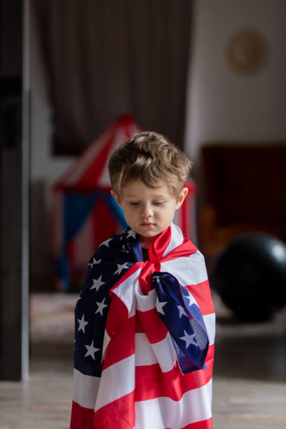 istock Little kid play with USA flag at home alone 1281152773