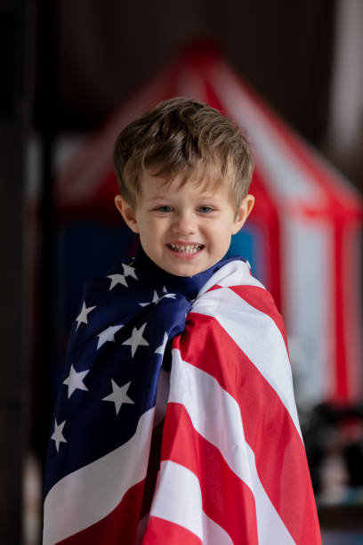istock Little kid play with USA flag at home alone 1281152780