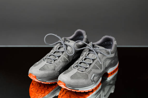 istock trekking sneakers with red sole, close-up view 1281152809