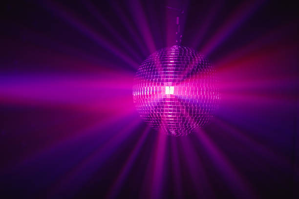 istock disco ball background with purple shiny rays 1281152832