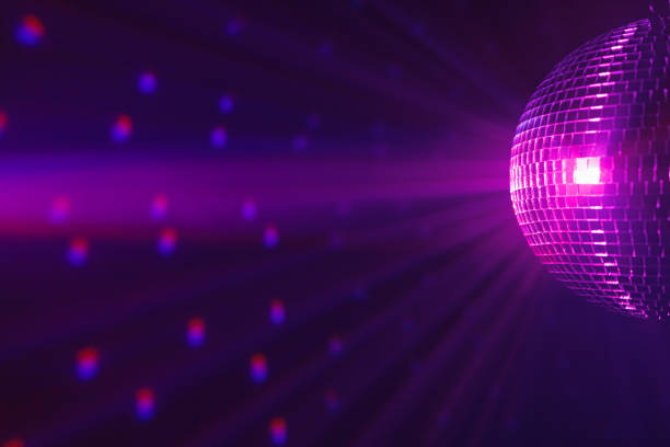 istock disco ball background with purple shiny rays 1281152847