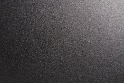 Black matte plastic background macro close up view